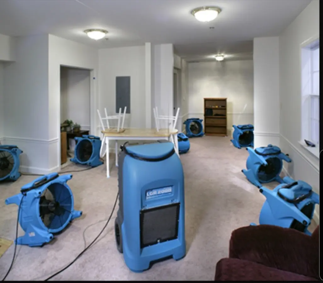 Air movers and dehumidifier setup for Water Damage Restoration in Tuttle